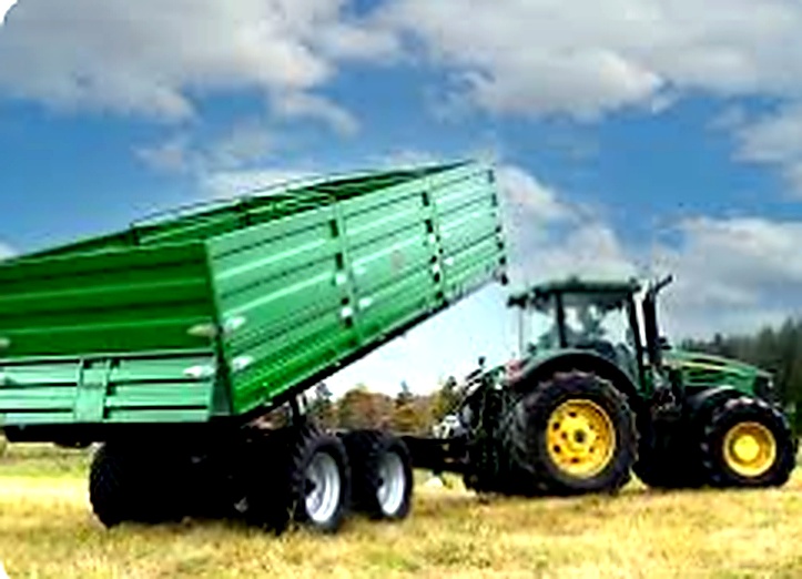 Tractor with green grain trailer